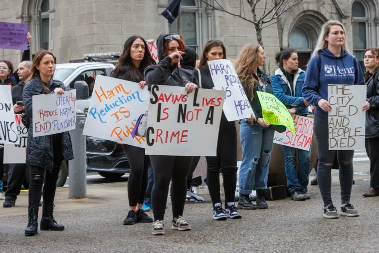 Harm reduction activists gathered outside City Hall on March 7. Harm reduction services help save lives, writes the Editorial Board, and must have city support as part of the plan to tackle the Kensington open-air drug market.