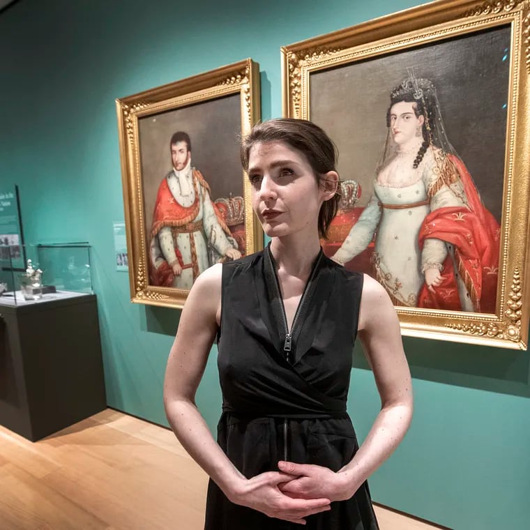 Art conservator Sarah Mastrangelo with portraits of Agustin de Iturbíde, emperor of Mexico, and his wife, the empress, Ana María, at the Philadelphia Museum of Art. Conservation revealed that both paintings conceal a hidden portrait, upside down, of painted-over Spanish royalty.