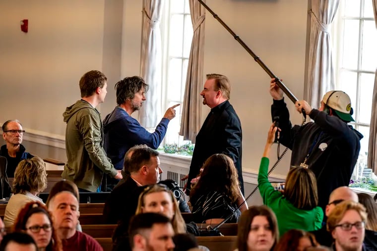 Actor Brian Dunkleman (left, co-host on the first season of "American Idol") confronts Brian O'Halloran (right, best known for “Clerks”) during filming of "Delco: The Movie" at the Springfield Presbyterian Church Tuesday.
