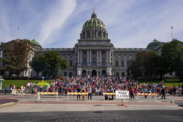 People gather outside the Pennsylvania State Capitol Building for the Bans Off Our Bodies rally in Harrisburg, Pennsylvania, October 2, 2021. The rally is part of demonstrations happening across the country defending women’s rights to seek abortions.